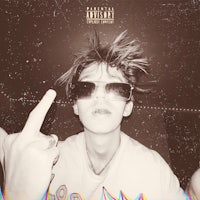 a young man with sunglasses and a ring on his finger